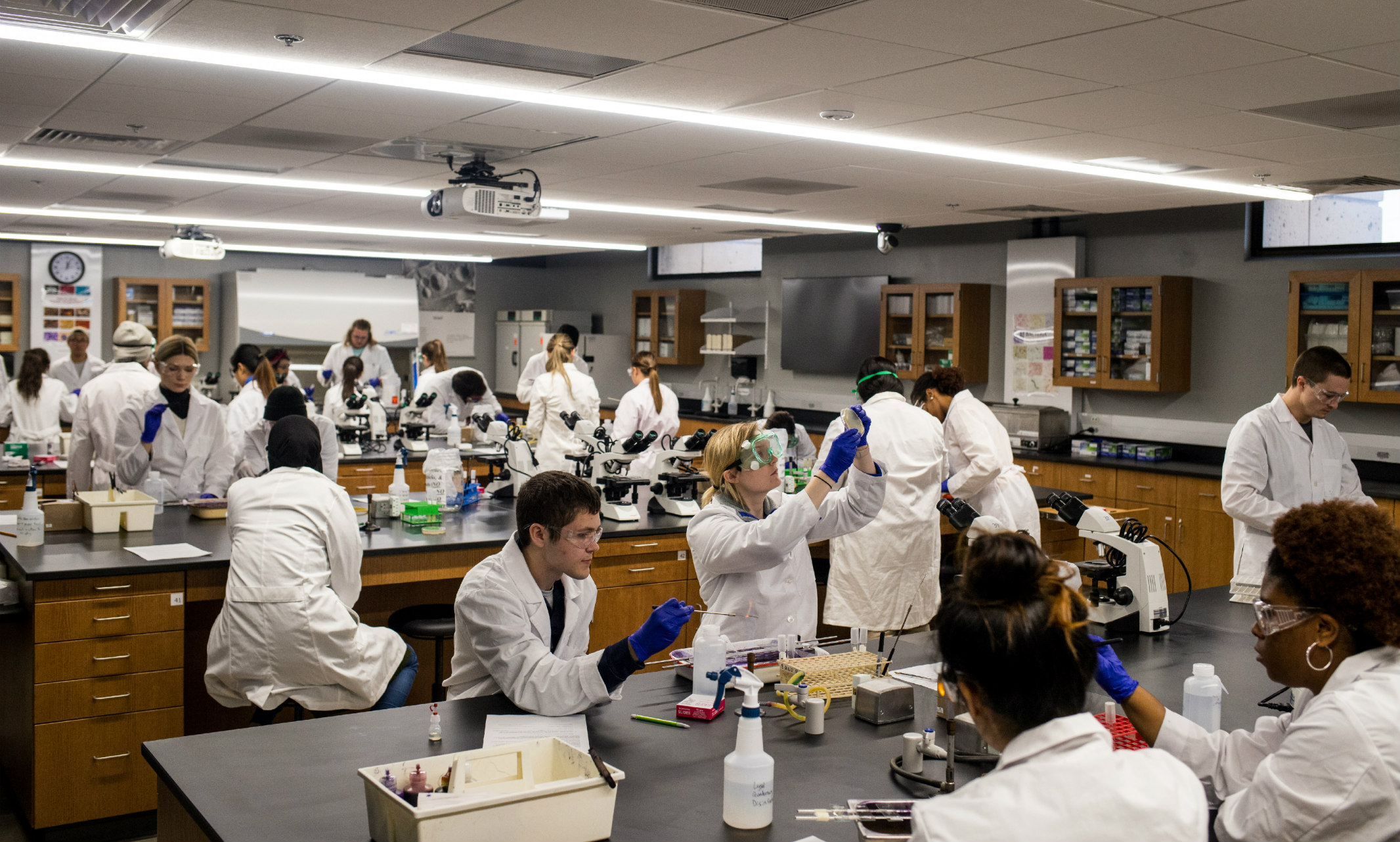 Group of students stand in UMKC School of Biological Sciences lab